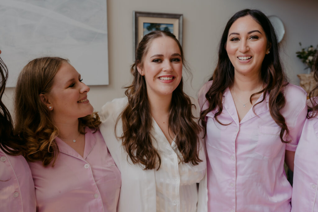 Bride with her bridesmaids in silk pyjamas